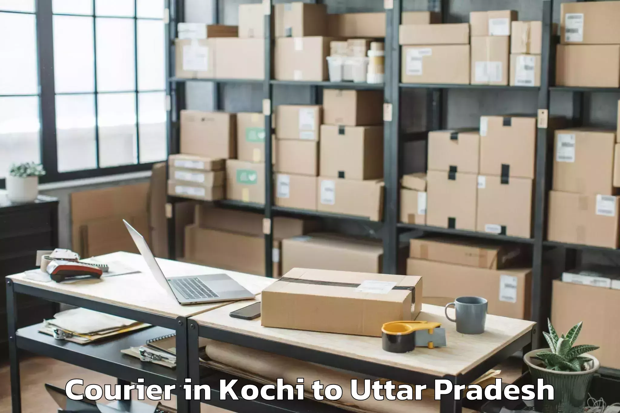 Book Your Kochi to Manjhanpur Courier Today